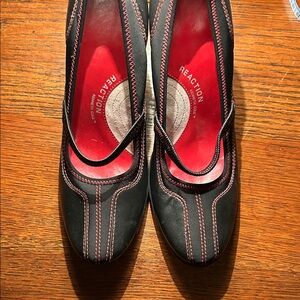 Kenneth Cole Reaction size 7 heels.  Black with red stitching.  Lightly worn.